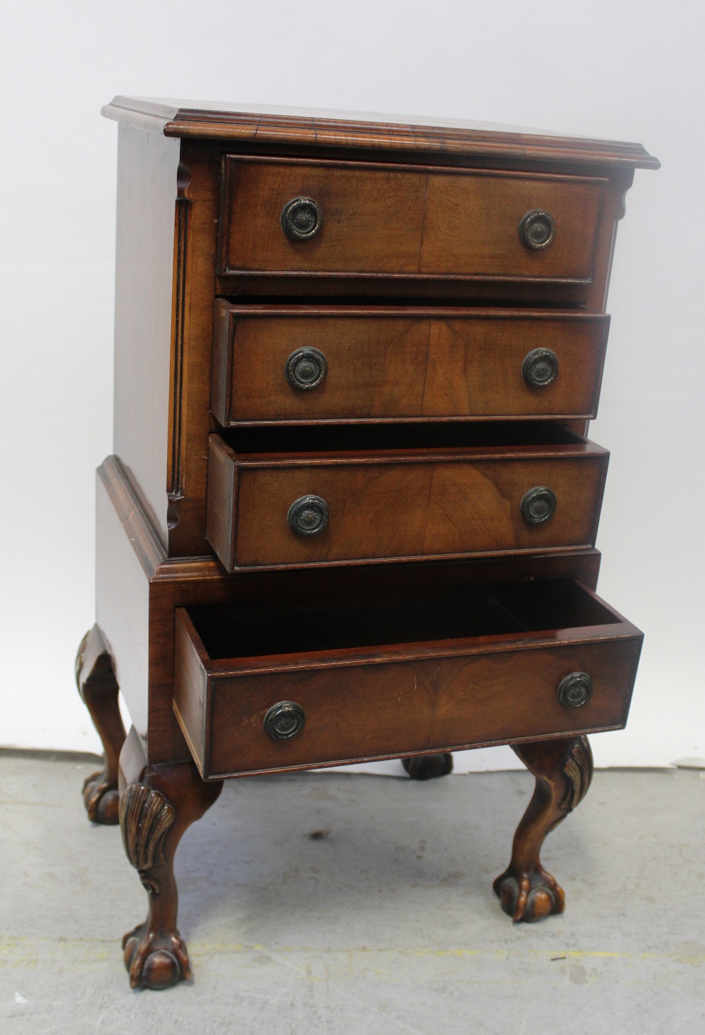 A modern reproduction mahogany tallboy of small proportions,