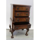 A modern reproduction mahogany tallboy of small proportions,