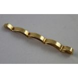 A Cartier 14ct yellow gold tie pin of wave form, stamped 'Cartier 14k' to reverse, length 5.