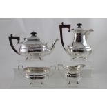 An Elizabeth II hallmarked silver four-piece tea service, with cast scrolling rim, Elkington & Co,