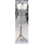 A vintage Formella 'Adjustform' female dressmaker's model on a tripartite wooden stand,