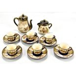 A Japanese Meiji period Satsuma tea service comprising teapot, lidded jug, six cups and six saucers,