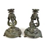 A pair of 19th century bronze Renaissance style candlesticks with detachable sconce above mermaids