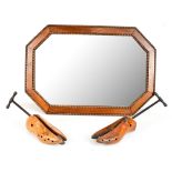 An oak framed octagonal wall mirror with beaded detail and bevelled glass, 65 x 45cm, and two