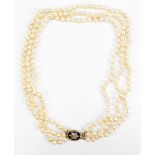 A multi string pearl necklace with yellow metal enamelled seed pearl and diamond clasp, length
