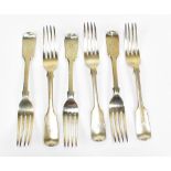 GEORGE ADAMS; a set of six Victorian hallmarked silver Fiddle pattern table forks with engraved