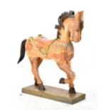 A carved wooden model of a horse, length 65cm, height 75cm.