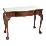 A mahogany side table with gadrooned detail and cutlery drawers to sides, on cabriole legs with