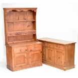 A 19th century pine dresser with boarded plate rack, shelf and four short drawers on base of two