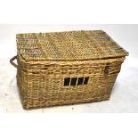 A vintage metal bound wicker laundry basket with rope twist handles, width 91cm.