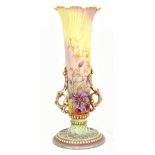 ROYAL WORCESTER; a trumpet vase of tapering form, with petal shaped rim, twin pierced handles and