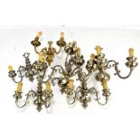 A set of five silvered scrolling wall lights with three (x2) and two (x3) branches, width of