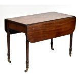 A Victorian mahogany Pembroke table with single end drawer raised on column supports.