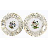 MEISSEN; a pair of early 20th century hand painted cabinet plates with pierced borders and painted