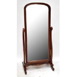 A reproduction mahogany cheval mirror with bevelled glass, height 150cm.Additional InformationAs