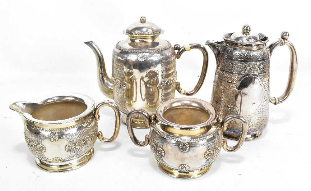 A circa 1900 Chinese Export silver three piece coffee set featuring chrysanthemum against chevron