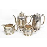 A circa 1900 Chinese Export silver three piece coffee set featuring chrysanthemum against chevron