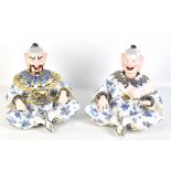 A pair of 19th century Continental hard paste porcelain nodding head figures, each decorated in