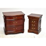 A pair of reproduction bedside chests of three drawers, raised on plinth bases, height 66cm (2).
