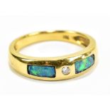 An 18ct yellow gold single stone diamond and opal panel set ring, size M 1/2, approx 3.8g.Additional
