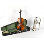A cased violin bearing spurious label, length of back 35cm, and a Besson & Co Class A horn (af) (