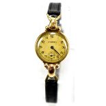 LONGINES; a lady's vintage 9ct yellow gold wristwatch, the circular dial set with Arabic numerals