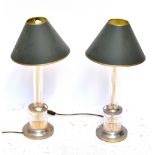 IN THE MANNER OF STUART CRYSTAL; a pair of table lamps with green shades, height 50cm (2).