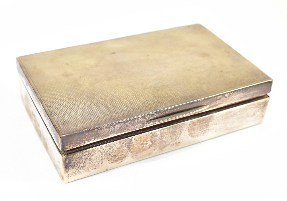 An Elizabeth II hallmarked silver cigarette case of rectangular form, Birmingham 1958, length
