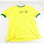 PELÉ; a signed replica Brazil shirt.