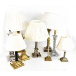 Nine 19th century and later Corinthian column table lamps including a silver plated example (9).