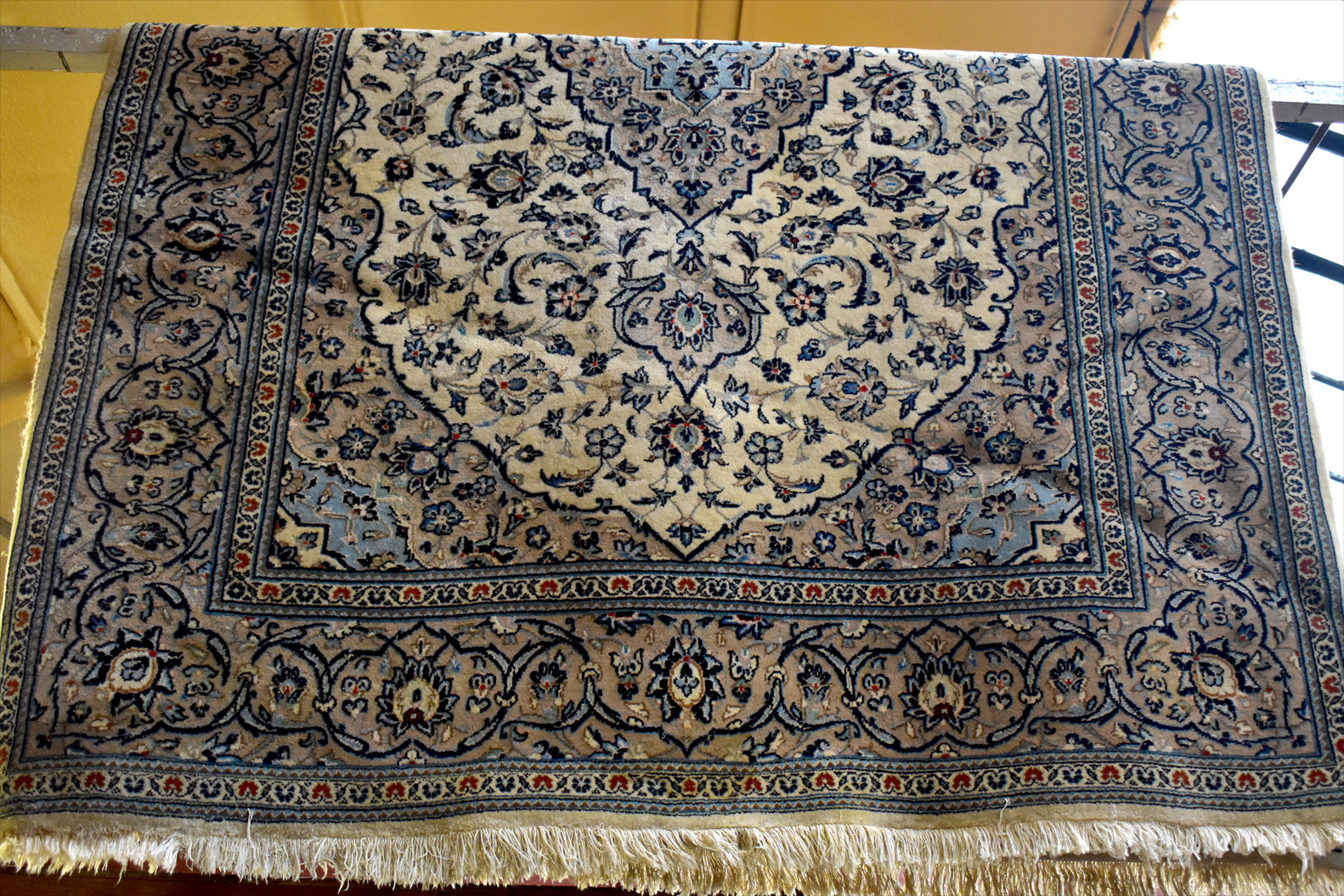 A Tabriz cream ground carpet, 260 x 180cm.Additional InformationIn need of a clean, stains and marks