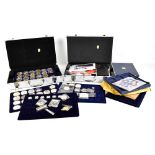 A coin collection including seven small yellow metal commemorative coins, all stamped 585, each