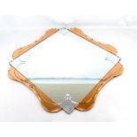 An Art Deco clear and peach glass wall mirror, width approx 77cm.Additional InformationIn good