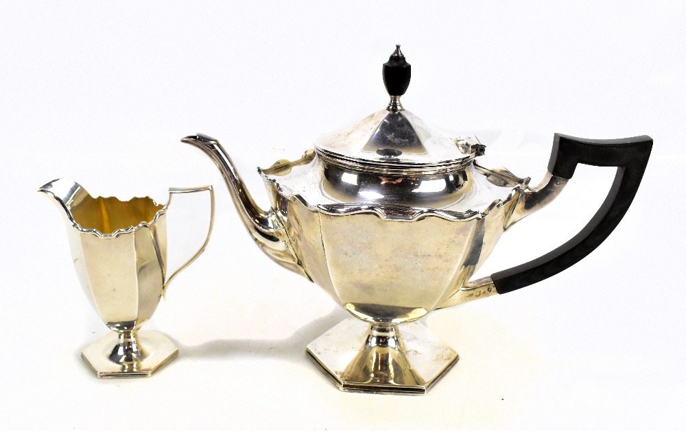 WILLIAM HUTTON & SONS LTD; a George V hallmarked silver teapot, inscribed to base 'To R.W. Evans