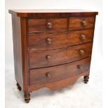 A Victorian mahogany bowfronted chest of two short over three long drawers, raised on bun feet,