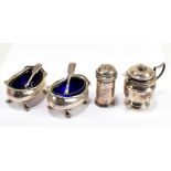 A pair of George V hallmarked silver blue glass lined open oval salts, Birmingham 1915, a