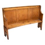 A late 19th century pine curved settle, length 164cm.