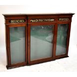 A large late 19th century mahogany wall mounted breakfront display cabinet with three glazed doors