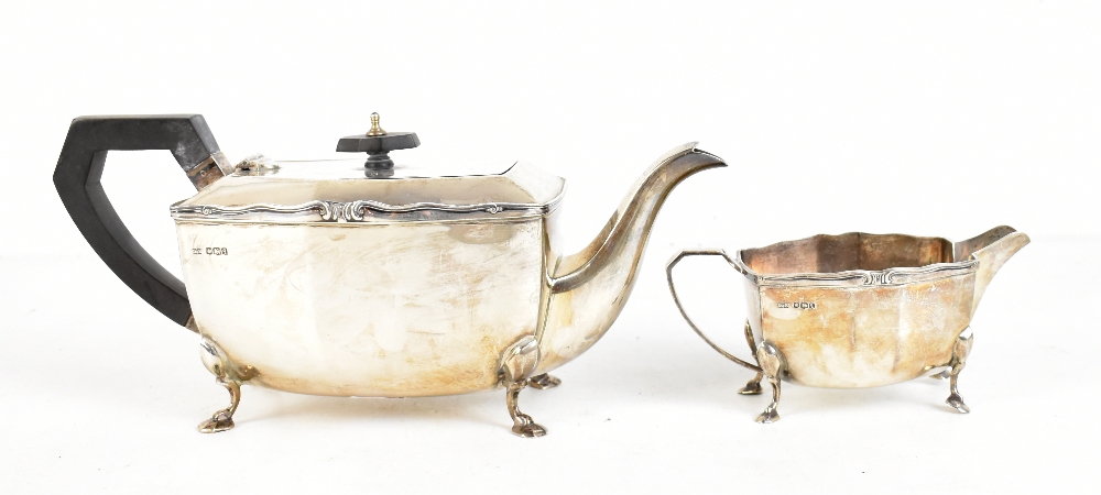 DUNCAN & SCOBBIE; a George V hallmarked silver teapot and milk jug, Sheffield 1933, approx 31ozt/