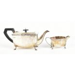 DUNCAN & SCOBBIE; a George V hallmarked silver teapot and milk jug, Sheffield 1933, approx 31ozt/
