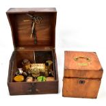 An early 20th century mahogany medicine box with various bottles and tins, 23 x 29 x 26.5cm, and a