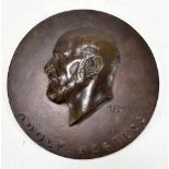 An early 20th century German bronze plaque, the obverse with bust in relief inscribed 'Adolf