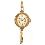 J. HARGREAVES & CO OF LIVERPOOL; a lady's gold plated open face wristwatch, the silvered dial set