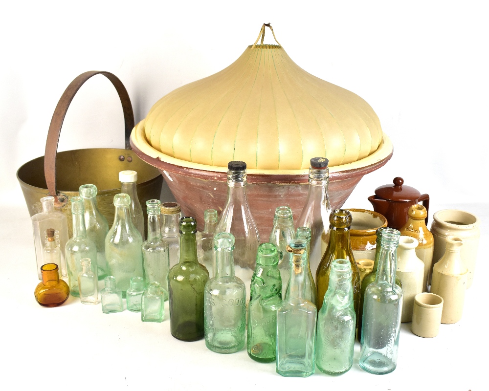 A collection of vintage glass bottles including Congleton and Buxton examples, stoneware jars with