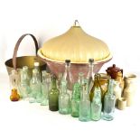 A collection of vintage glass bottles including Congleton and Buxton examples, stoneware jars with