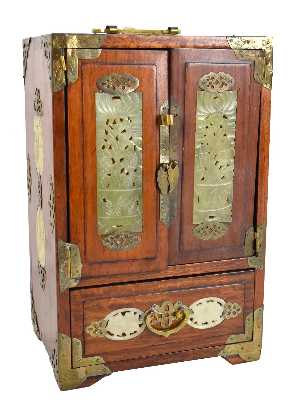 A hardwood brass detailed tabletop jewellery cabinet with twin doors enclosing four drawers with a