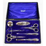 A cased variously hallmarked silver handled manicure set.