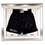 IRON MIKE TYSON; a pair of signed black boxing shorts, with certificate of authenticity from