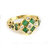 An 18ct yellow gold emerald and diamond ring set with ten emeralds and five diamonds, ring size O,