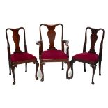 A set of twelve Queen Anne style flat back dining chairs raised on cabriole supports (11+1).